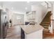 Bright eat-in kitchen featuring an island, granite countertop, and stairs to the 2nd story at 20146 Heritage Point Dr, Tampa, FL 33647