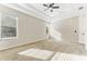 Spacious main bedroom with large windows, tray ceiling and neutral carpet at 20146 Heritage Point Dr, Tampa, FL 33647