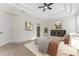 Calm main bedroom with tray ceilings, soft carpet, and natural light, a serene retreat at 20146 Heritage Point Dr, Tampa, FL 33647