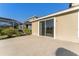 Concrete patio with a view of the backyard and screened enclosure at 20146 Heritage Point Dr, Tampa, FL 33647