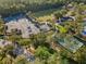 This aerial view showcases neighborhood tennis courts, park and playground for residents at 20146 Heritage Point Dr, Tampa, FL 33647