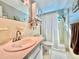 Bright bathroom features a shower and vanity with ample counter space at 2469 Franciscan Dr # 53, Clearwater, FL 33763