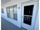 Building entrance featuring unit number 53, a screen door, and windows at 2469 Franciscan Dr # 53, Clearwater, FL 33763
