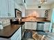 Bright kitchen featuring stainless steel appliances and stylish tile backsplash at 2469 Franciscan Dr # 53, Clearwater, FL 33763