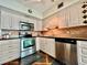Charming kitchen with stainless steel appliances and wooden cabinets at 2469 Franciscan Dr # 53, Clearwater, FL 33763