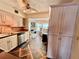 Open kitchen design with stainless steel appliances and an adjacent living area at 2469 Franciscan Dr # 53, Clearwater, FL 33763