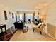 Open living area featuring a large sofa, accent chair, and stylish decor on a plush carpet at 2469 Franciscan Dr # 53, Clearwater, FL 33763