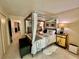 Spacious main bedroom with four-poster bed, stylish furniture, and ample closet space at 2469 Franciscan Dr # 53, Clearwater, FL 33763