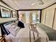 Relaxing main bedroom featuring a luxurious bed and en-suite bathroom at 2469 Franciscan Dr # 53, Clearwater, FL 33763