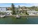Beautiful waterfront property showcasing private dock, backyard, and canal access for boating and recreation at 2540 S Shore Se Dr, St Petersburg, FL 33705