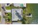 Overhead view of the house showing the roof shape, backyard, and the private dock on the canal at 2540 S Shore Se Dr, St Petersburg, FL 33705