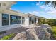 Large paver patio with stunning canal view and lush greenery provides a relaxing outdoor space at 2540 S Shore Se Dr, St Petersburg, FL 33705