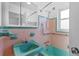 Vintage bathroom with colorful tiles, fixtures and finishes at 2540 S Shore Se Dr, St Petersburg, FL 33705