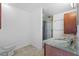 Bathroom with marble vanity and glass-enclosed shower at 2540 S Shore Se Dr, St Petersburg, FL 33705