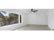 Bright bedroom features sleek ceiling fan and great natural lighting at 2540 S Shore Se Dr, St Petersburg, FL 33705