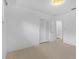 Simple bedroom design with neutral carpet, double closet and white walls at 2540 S Shore Se Dr, St Petersburg, FL 33705
