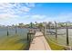 Wooden dock with a boat lift and calm waters at 2540 S Shore Se Dr, St Petersburg, FL 33705