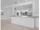 Open-concept kitchen counter with granite countertops in a bright, modern interior at 2540 S Shore Se Dr, St Petersburg, FL 33705