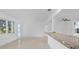 Bright living space shows modern finishes and a seamless flow, next to the kitchen at 2540 S Shore Se Dr, St Petersburg, FL 33705