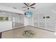 Open living area boasts terrazzo flooring with an anchor design, with slider to water at 2540 S Shore Se Dr, St Petersburg, FL 33705