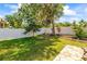 Spacious backyard featuring a well-maintained lawn and partial fence at 2613 Bonterra Blvd, Valrico, FL 33594
