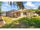 Backyard featuring a partial view of the enclosed patio at 2613 Bonterra Blvd, Valrico, FL 33594