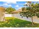 Backyard featuring a partial fence and green grass at 2613 Bonterra Blvd, Valrico, FL 33594
