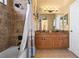 Bathroom with large vanity, double sinks, walk-in shower, and neutral color palette at 2613 Bonterra Blvd, Valrico, FL 33594