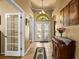 Grand foyer with tile flooring, and decorative glass double-door entry at 2613 Bonterra Blvd, Valrico, FL 33594