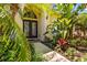 Close-up view of the home's entrance, highlighting the beautiful landscaping at 2613 Bonterra Blvd, Valrico, FL 33594