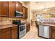 View of the kitchen featuring stainless steel appliances and granite countertops at 2613 Bonterra Blvd, Valrico, FL 33594