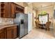 Bright kitchen with stainless steel refrigerator and view to breakfast nook at 2613 Bonterra Blvd, Valrico, FL 33594