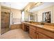 A luxurious main bathroom features double sinks, a walk-in shower, and a soaking tub at 2613 Bonterra Blvd, Valrico, FL 33594