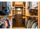 Custom walk-in closet features lots of hanging space, drawers, shelves, and a full-length mirror at 2613 Bonterra Blvd, Valrico, FL 33594