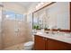 Modern bathroom with a glass-enclosed shower and vanity area at 3009 Sheehan Dr, Land O Lakes, FL 34638