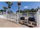 Outdoor grilling area with stainless steel grills and brick pavers, perfect for community barbecues near the pool at 3009 Sheehan Dr, Land O Lakes, FL 34638