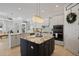 Spacious kitchen with a large island, modern appliances, and ample cabinet space at 3009 Sheehan Dr, Land O Lakes, FL 34638