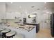 Stylish kitchen with a granite island, seating, and stainless steel appliances at 3009 Sheehan Dr, Land O Lakes, FL 34638