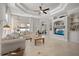 Bright and airy living room featuring tile floors and access to outdoor living area at 3009 Sheehan Dr, Land O Lakes, FL 34638