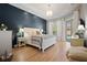 Serene main bedroom with a king bed, neutral tones, and access to the pool at 3009 Sheehan Dr, Land O Lakes, FL 34638