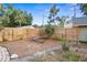Spacious backyard with mature trees, a hammock, and a wooden fence, perfect for outdoor relaxation at 3120 8Th N Ave, St Petersburg, FL 33713