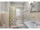 This is a cozy bathroom with tile floors, a shower and tub, and a classic toilet and sink at 3120 8Th N Ave, St Petersburg, FL 33713