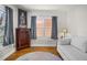 A living space with hardwood floors, a white couch, and lots of natural light coming from the windows at 3120 8Th N Ave, St Petersburg, FL 33713
