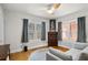 A living space with hardwood floors, a white couch, and lots of natural light coming from large windows at 3120 8Th N Ave, St Petersburg, FL 33713