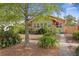 Inviting home exterior with mature trees, green foliage, and sidewalk approach at 3120 8Th N Ave, St Petersburg, FL 33713