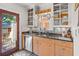 Stylish kitchen with stainless steel appliances, granite counters, and access to outdoor deck at 3120 8Th N Ave, St Petersburg, FL 33713