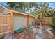 View of shed from the side, including a landscape path and fenced-in yard at 3120 8Th N Ave, St Petersburg, FL 33713