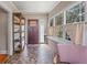 Bright sun room with large windows, shelving, and unique architectural details at 3120 8Th N Ave, St Petersburg, FL 33713