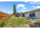 Backyard featuring a fire pit, patio, landscaping, and a privacy fence at 4209 Stratfield Dr, New Port Richey, FL 34652