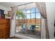 Backyard view through sliding glass door featuring outdoor seating at 4209 Stratfield Dr, New Port Richey, FL 34652